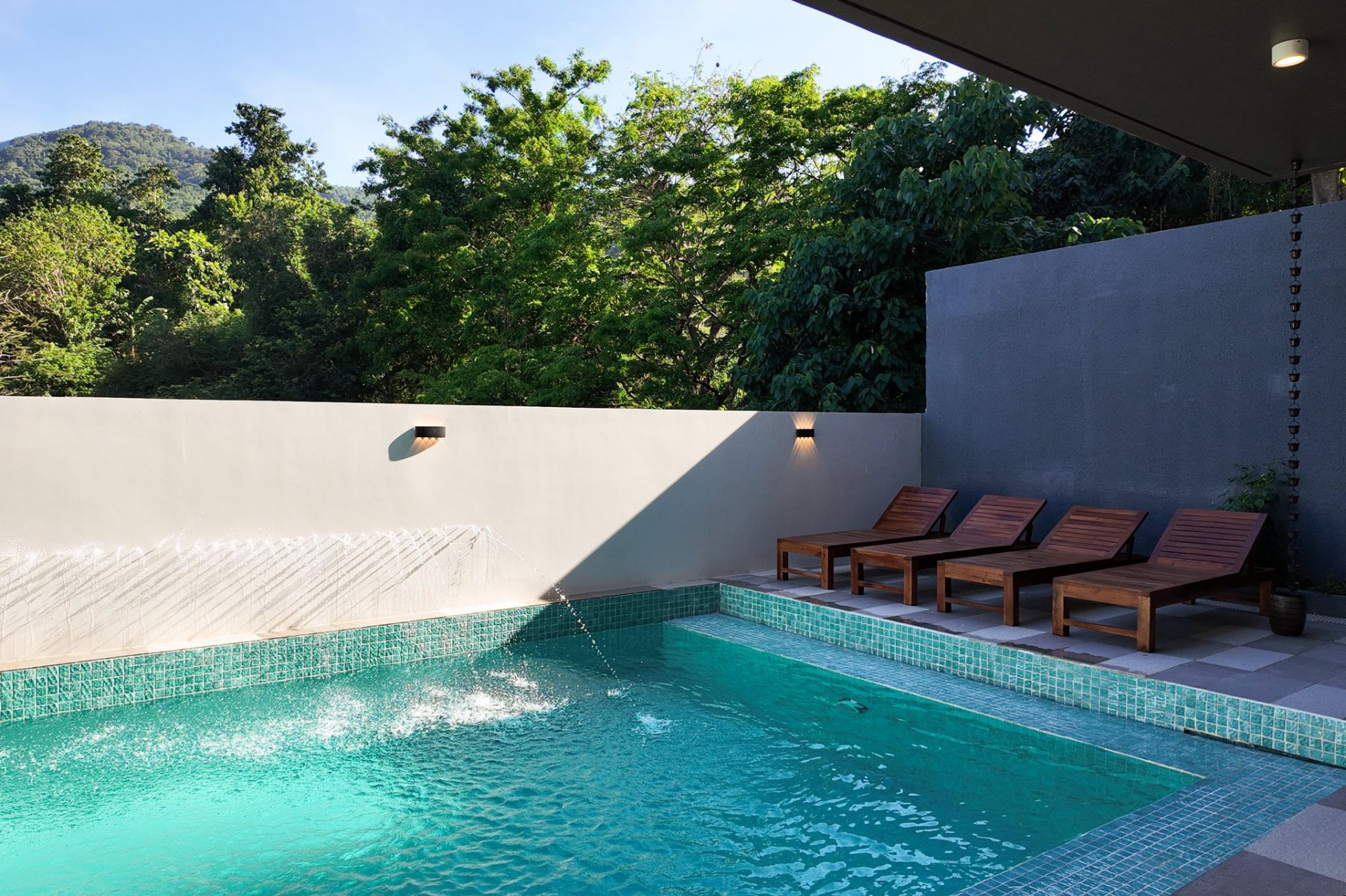 Hot spring pool with loungers